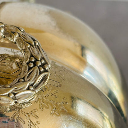 Close-up of a silver ornate Antique Biscuit Warmer | Folding Biscuit Box with intricate designs