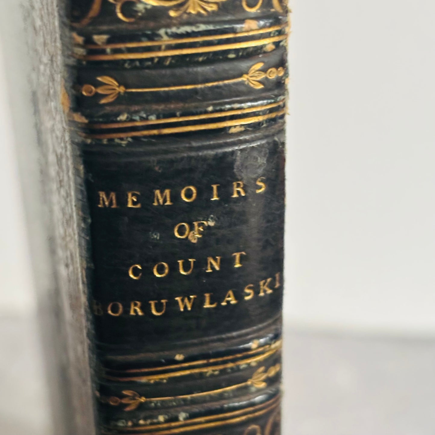 Antique book titled 'Memoirs of Count Boruwlaski' with gold embossed text on a white background