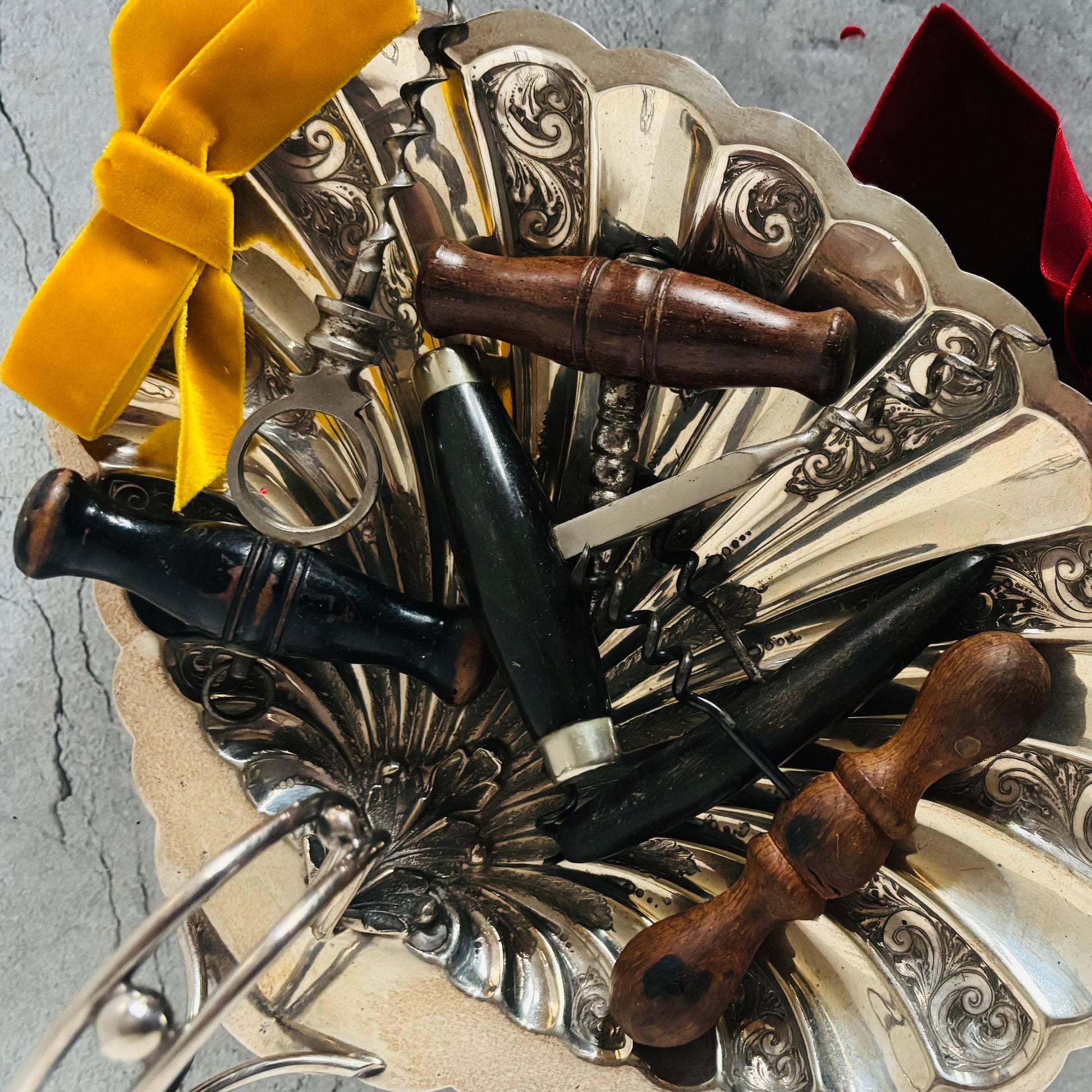 Victorian Treen Corkscrews in an Antique silver dish