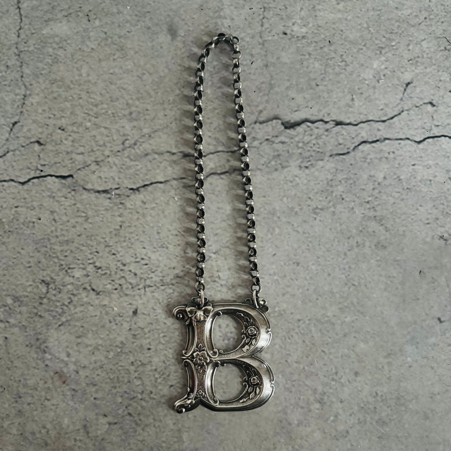 The Director Kasey - Antique Silver Letter Decanter Label