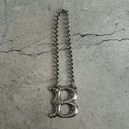 The Director Kasey - Antique Silver Letter Decanter Label