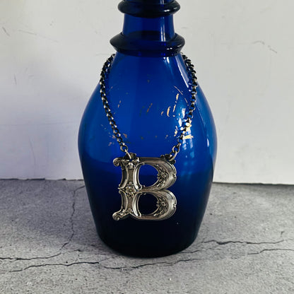 The Director Kasey - Antique Silver Letter Decanter Label