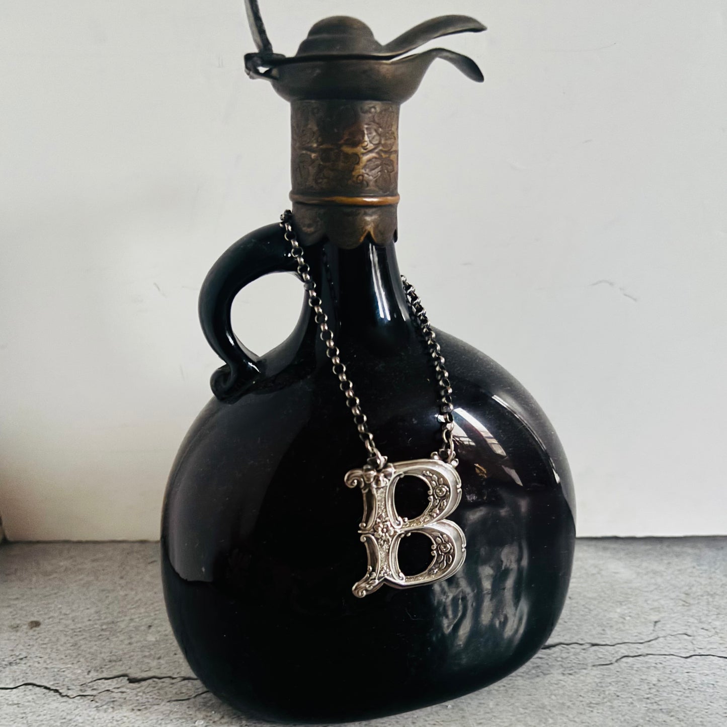 The Director Kasey - Antique Silver Letter Decanter Label