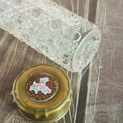 Decorative glass item with intricate patterns on a wooden surface
