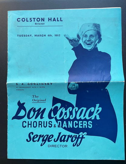 Promotional poster for the Don Cossack Chorus & Dancers at Colston Hall, Bristol, featuring a smiling man in a coat.
