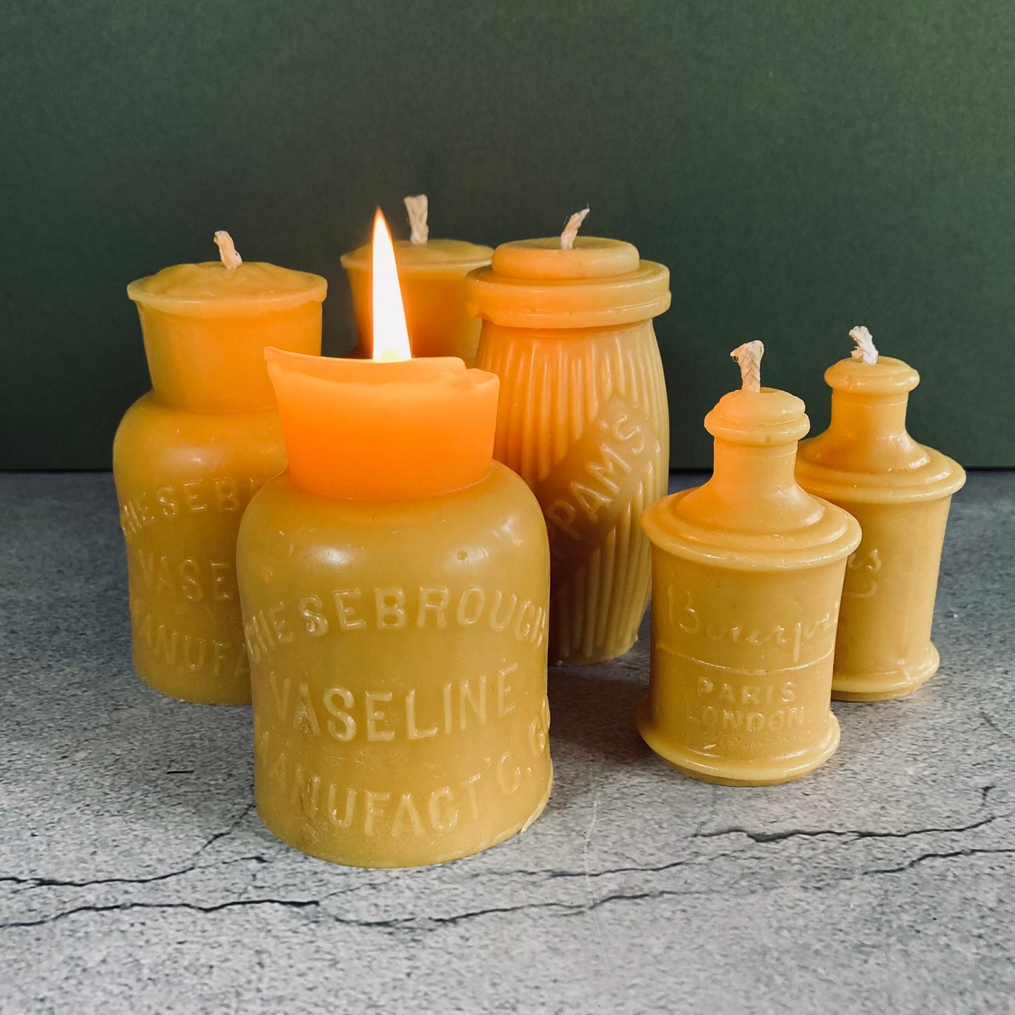 Handmade Beeswax Candles in Antique Bottle Designs