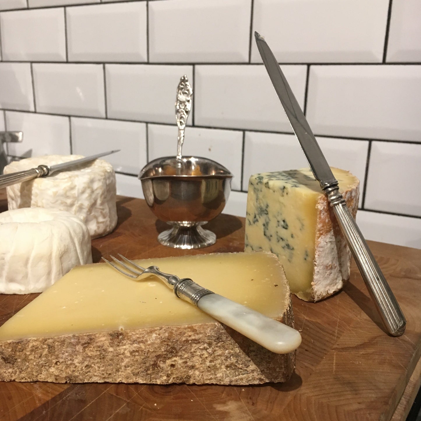 cheeseboard with antique silver accessories