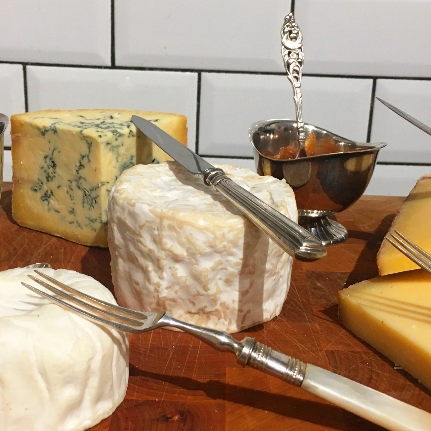 cheeseboard with antique silver accessories